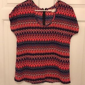 Bright colored top with fun pattern